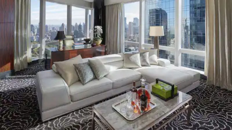 Image may contain Furniture Building Housing Couch Rug Indoors and Table